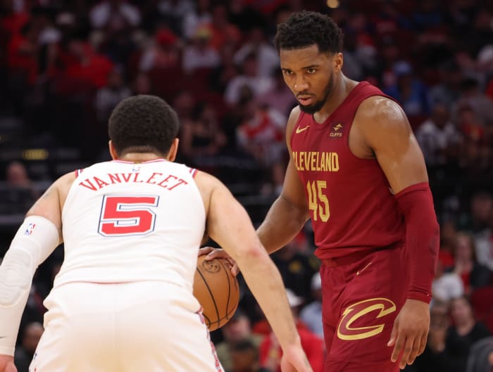 Mar 16, 2024; Houston, Texas, USA; Cleveland Cavaliers guard Donovan Mitchell (45) dribbles against Houston Rockets guard Fred VanVleet (5) in the second half at Toyota Center.